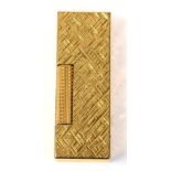 A Dunhill gold plated lighter with textured finish