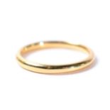 An 18 carat gold band ring, finger size N, 2.6g