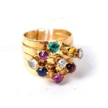 A multi gemstone stacking ring, of five bands each set with a cabochon, including emerald,