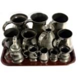 A group of 19th century English pewter measures and tankards