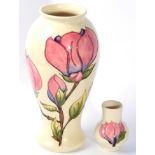 A Moorcroft Magnolia vase and another (2)