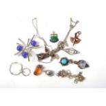 A German Jugendstil carnelian pendant necklace, length 40cm and ten various pendants and charms,