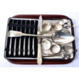 A quantity of assorted silver including a basting spoon; teaspoon; napkin rings etc