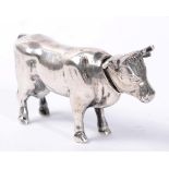 A German silver model of a cow, indistinct marks to tail, 800 standard, with detachable head, 5.