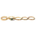 A 9 carat gold emerald ring; and four 9 carat gold rings, 11.2g gross (5)