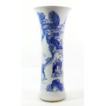 A Chinese Porcelain Beaker Vase, in Kangxi style, painted in underglaze blue with figures on a river