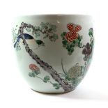 A Chinese Porcelain Jardinière, 19th century, painted in famille rose enamels with foliage amongst