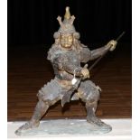 A Japanese Bronze Figure of a Samurai, Meiji period, standing holding a spear in both hands, on a