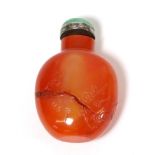 A Chinese Carnelian Snuff Bottle, of ovoid form, engraved with scrolling foliage, with silver