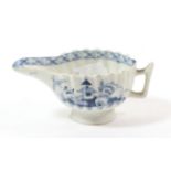 A Lowestoft Porcelain Butter Boat, circa 1775, of fluted form, painted in underglaze blue with a