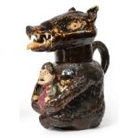 A Staffordshire Pottery Bear Jug, circa 1810, naturalistically modelled seated holding a
