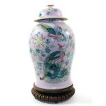 A Chinese Porcelain Baluster Jar and Cover, 19th century, painted in famille rose enamels with