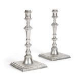 A Pair of Cast Silver Candlesticks of George III Style, maker's mark JLC, London 1964, the knopped