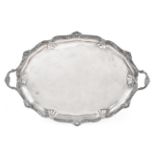 A Large Victorian Silver Twin Handled Tray, Edward Hutton, London 1892, shaped oval with an