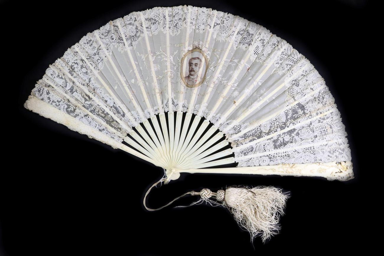 A Late 19th Century Point De Gaze Needle Lace Fan Mounted on Ivory, the sticks gilded, the guards