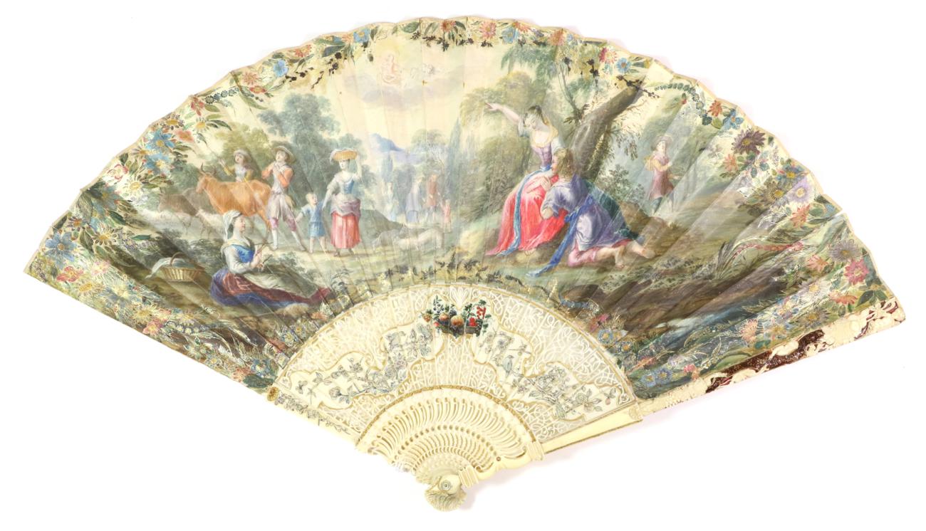 An Early 18th Century Ivory Fan, the monture carved, pierced and inlaid with mother of pearl. The