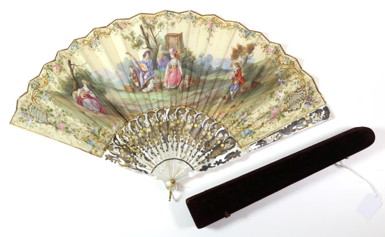 A Mid-19th Century Mother-of-Pearl Fan, the monture gilded and silvered, carved and pierced. The