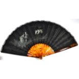 A Circa 1875 Fan, with a painted black silk leaf, edged with black Chantilly lace, mounted à l'