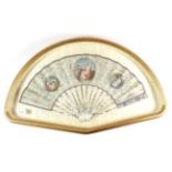 An 18th Century Ivory Fan, enclosed in a glazed fan shaped wooden display case. The eau de nil