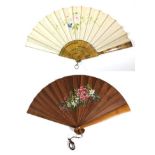 A Large Late 19th Century Wooden Fan, with interesting markings to the polished wood. The leaf of