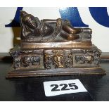 A small antique Tibetan bronze figure of a reclining Buddha