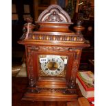 Edwardian mantle clock in carved walnut case with brass dial & silvered chapter ring, 17" high x 12"