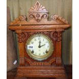 American carved oak cased mantle clock