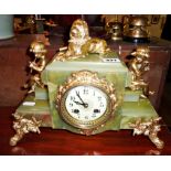 Onyx mantle clock with gilt cherubs and lion to top