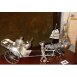 Chinese silver plated rickshaw cruet set and a similar model of a junk