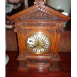 Victorian carved oak mantle clock with brass dial & enamel numerals