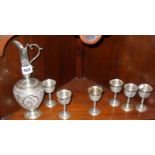 White metal Persian wine carafe, with set of six small matching goblets