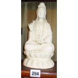 Chinese blanc de chine figure of Guan Yin seated on lotus flower, 25cm