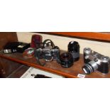 A Corfield Periflex 2 camera and an Olympus OM10 and assorted lenses and accessories