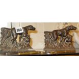 Two 19th c. cast iron shooting dogs bookends and two old brass glass cutting tools