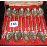 Set of 12 engraved Hong Kong silver teaspoons with finials shaped as snakes