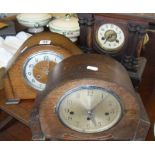 Three wood-cased mantle clocks