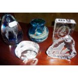 Five various glass paperweights, inc. Mdina