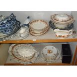 Blue & white Victorian tableware, floral dishes, meat platters etc (two shelves)