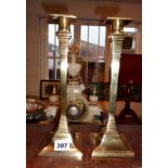 Pair of Victorian brass candlesticks of square tapering form