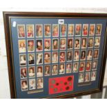 Framed "Kings & Queens" cigarette card collection and mounted with the "coinage of George VI"