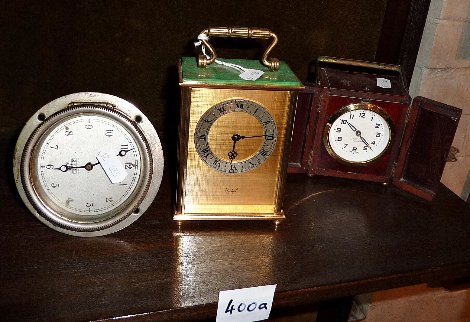 Imhof carriage clock, German Art Deco travel clock in wooden case, and a Smiths vintage automobile