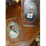 Two Victorian oil miniature portraits of a man and wife in leather frames
