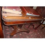 19th c. rosewood foldover card table with centre column above platform base