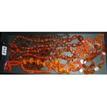 Quantity of amber? and amber bakelite vintage beaded necklaces, with similar prayer/worry beads etc