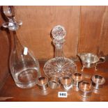 Set of six silver-plated napkin rings, two decanters and a silver-plated cream jug