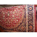 A modern Keshan rug on red ground, 1.90m x 1.40m