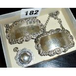 Two hallmarked silver decanter labels for Whisky and Brandy, and a WW2 silver watch fob medal for