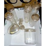 Seven cut glass vanity jars with hallmarked silver lids and three extra silver lids