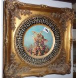 Gilt framed Continental hand painted china plate with decoration of kissing fairies