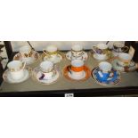 Ten different pairs of china coffee cans and saucers